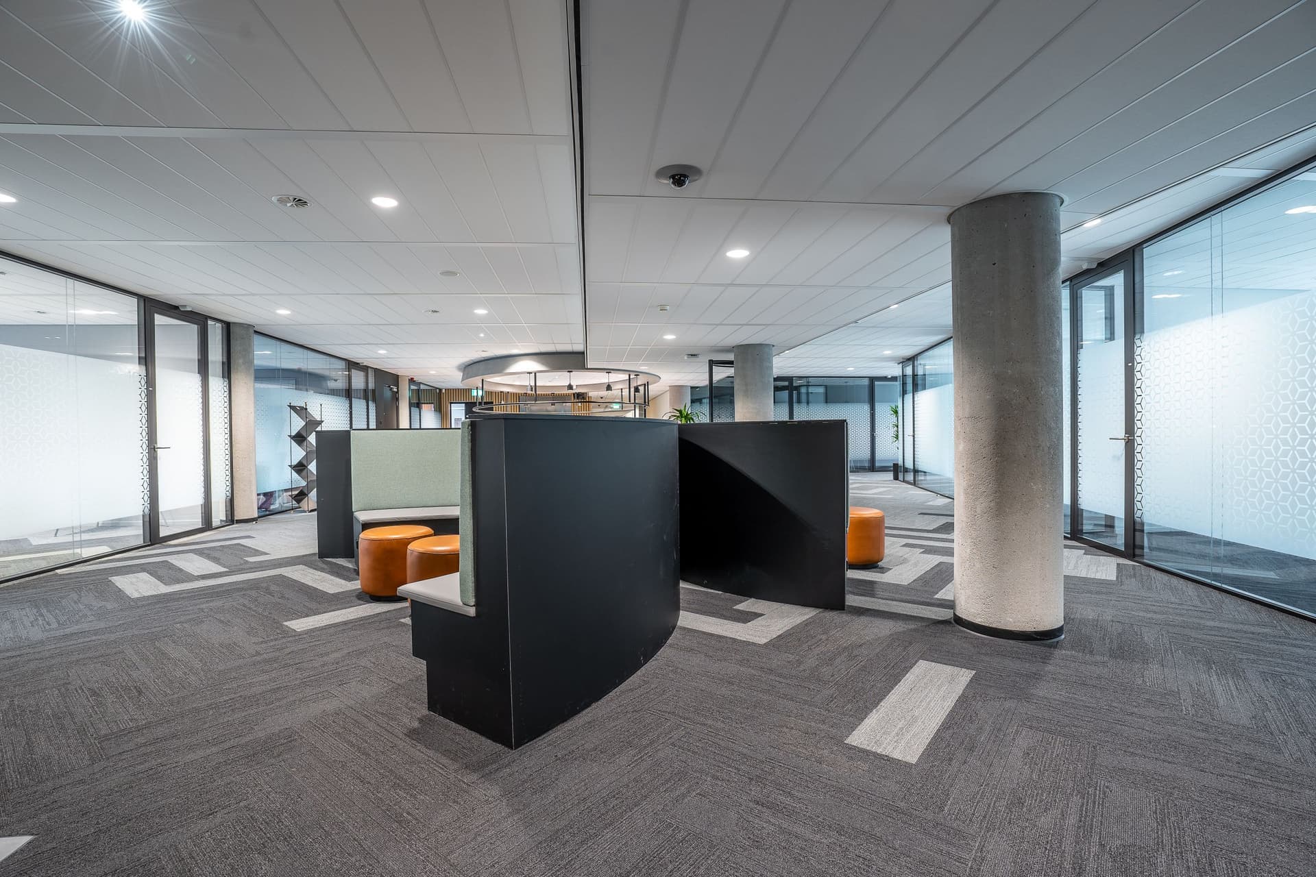 Office fit-out with downlights and glass partitions